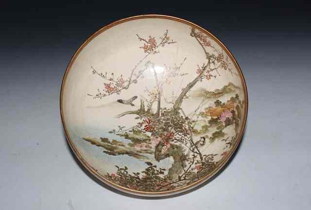 Appraisal: A JAPANESE SATSUMA EARTHENWARE BOWL decorated birds amongst blossom signed