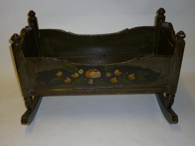 Appraisal: A painted wood doll's cradle on rockers with flowers to