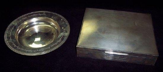 Appraisal: A cigarette box with hinged engine turned cover the front