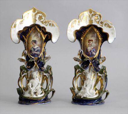 Appraisal: PAIR OF PARIS PORCELAIN MANTLE VASES Each floriform with oval