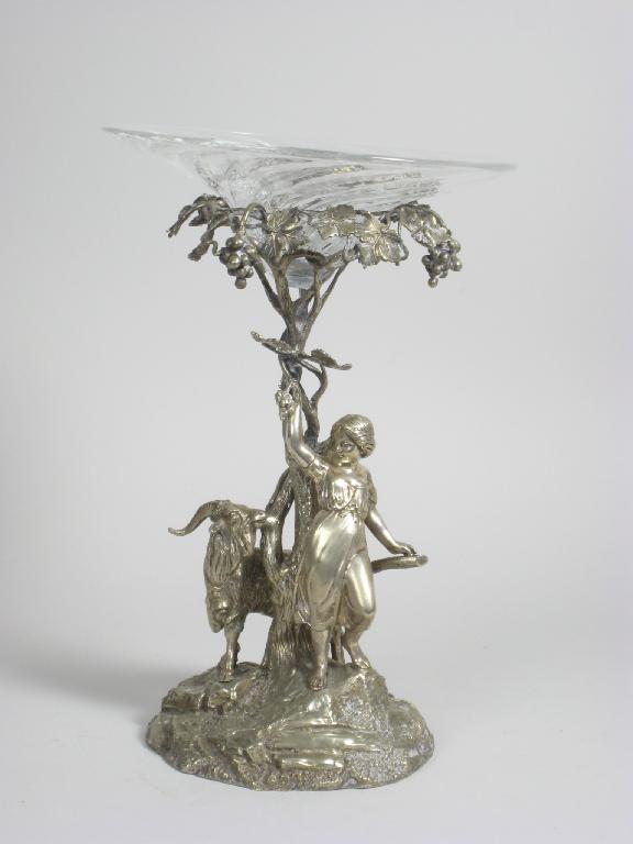 Appraisal: A silver plated Centre Piece with girl leading a goat