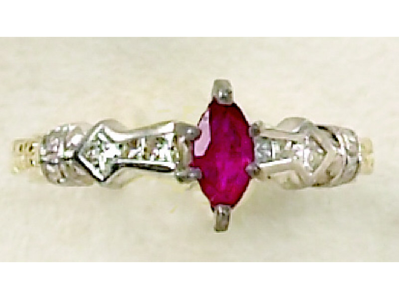 Appraisal: RUBY AND DIAMOND RING k gold engraved channel set ring