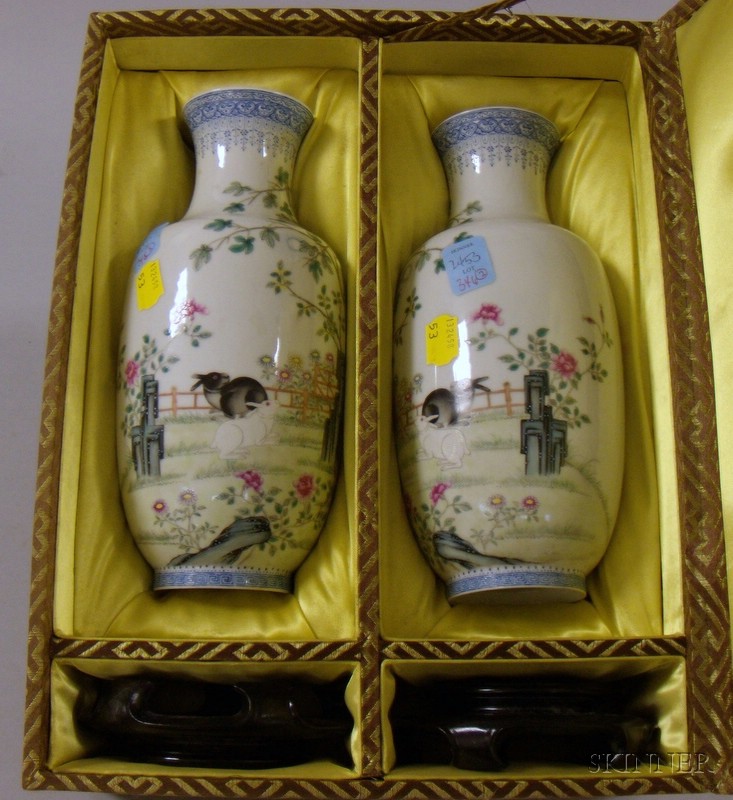 Appraisal: Pair of Cased Oriental Vases with Stands signed depicting black