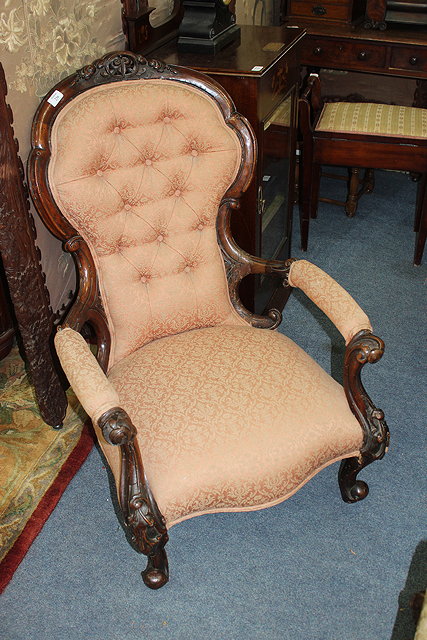 Appraisal: A VICTORIAN MAHOGANY OPEN ARMCHAIR with carved frame and shaped