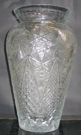 Appraisal: A CUT CRYSTAL FLORAL DISPLAY VASE jar-shaped hand cut and