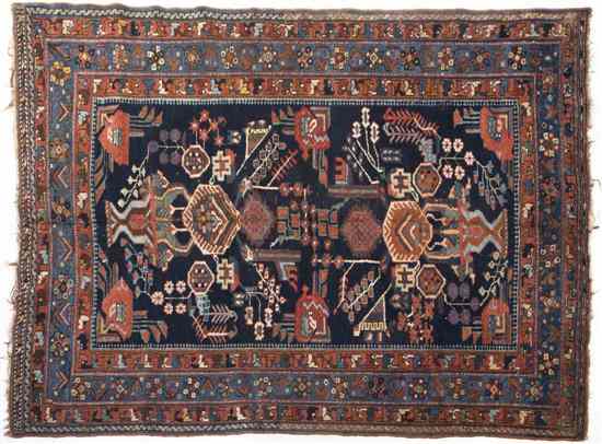 Appraisal: A Northwest Persian Wool Rug having a geometric central medallion