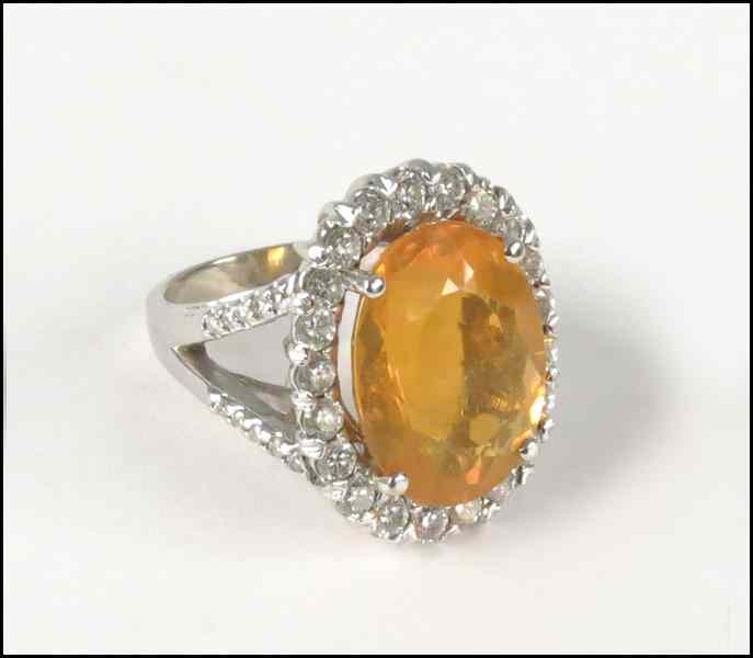 Appraisal: KARAT WHITE GOLD FIRE OPAL AND DIAMOND RING Opal is