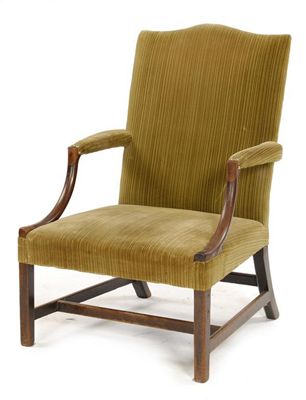 Appraisal: A George III mahogany library armchair with a shaped back