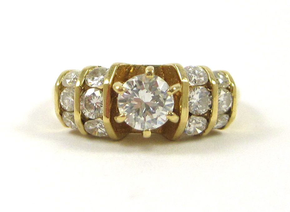 Appraisal: DIAMOND AND EIGHTEEN KARAT GOLD RING with six round-cut diamonds