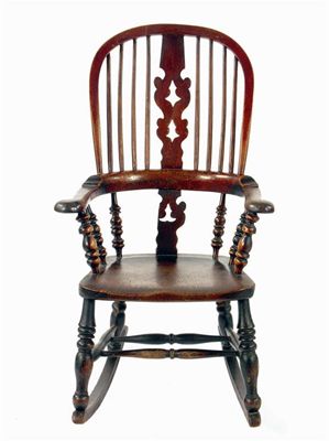 Appraisal: A Victorian ash highback rocking armchair part of lower splat