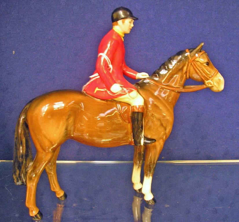 Appraisal: A Beswick model of a huntsman on a chestnut horse