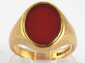 Appraisal: A carat gold signet ring with engraved oval cornelian