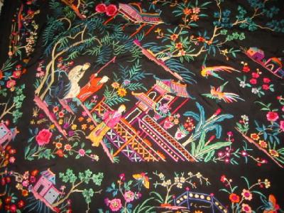 Appraisal: AN ORIENTAL BLACK SILK SHAWL embroidered with figures within foliate