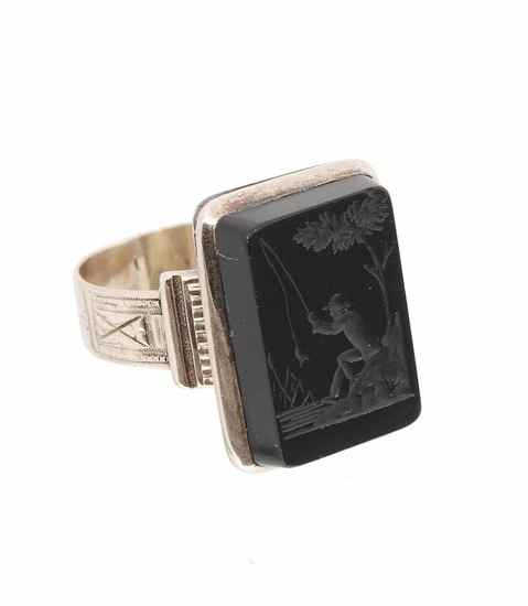 Appraisal: A hard stone and gold intaglio ring the black rectangular