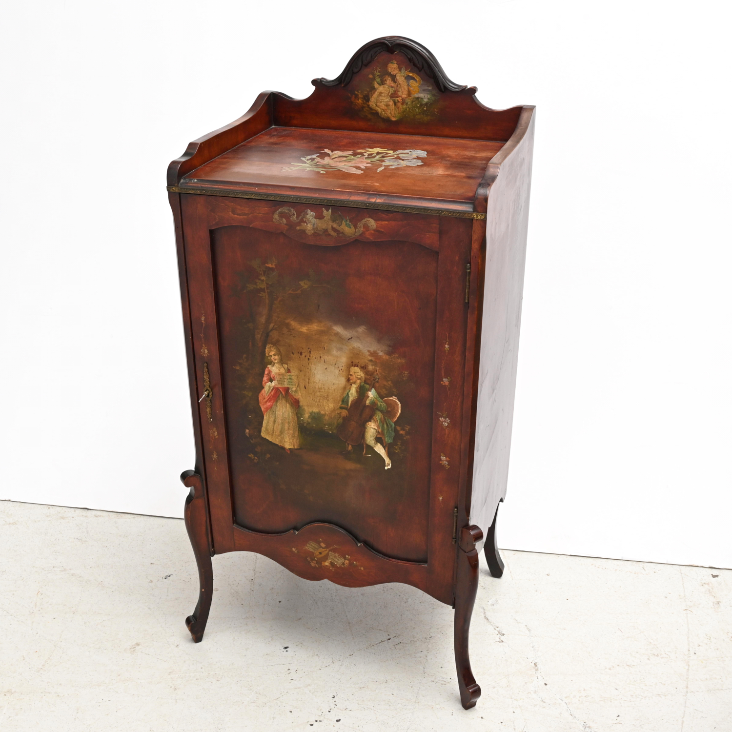 Appraisal: VICTORIAN STYLE MUSIC CABINET th c with classical figures cherubs