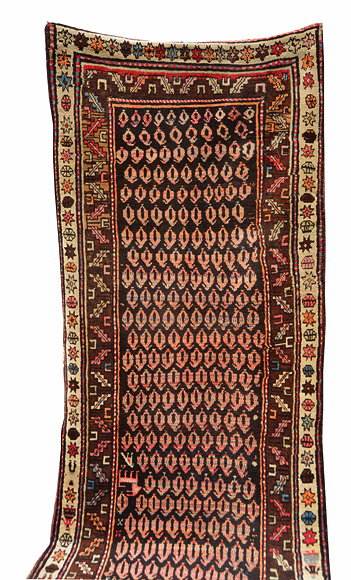 Appraisal: A CAUCASIAN BROWN GROUND RUNNER with geometric designs to the