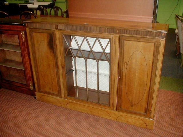 Appraisal: An Edwardian string inlaid bleached mahogany three door side cabinet