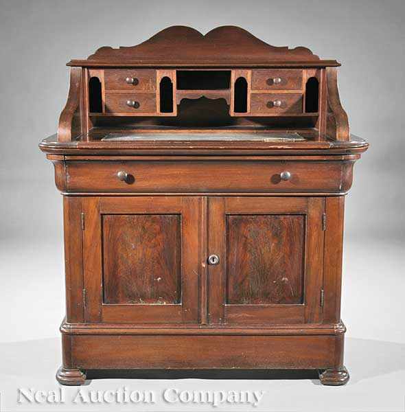 Appraisal: An American Carved Walnut Desk mid- th c shaped crest