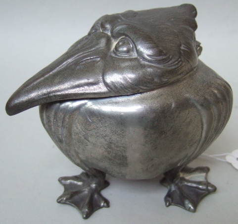 Appraisal: A pewter grotesque bird inkwell in the Martin Brothers style