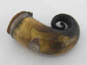 Appraisal: A Scottish horn snuff mull with white metal mounts and