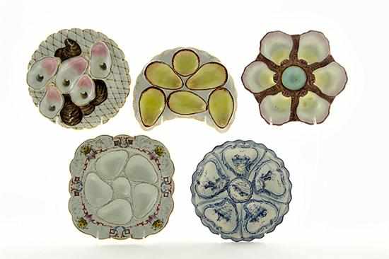 Appraisal: Continental porcelain oyster plates circa comprising crest-shape -well Limoges plate