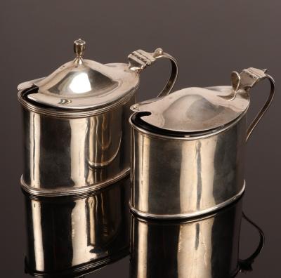 Appraisal: An oval silver mustard pot Birmingham with hinged cover and