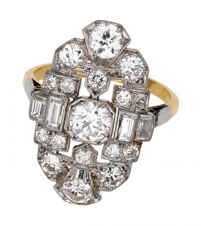 Appraisal: AN ART DECO DIAMOND RING with round brilliant and baguette