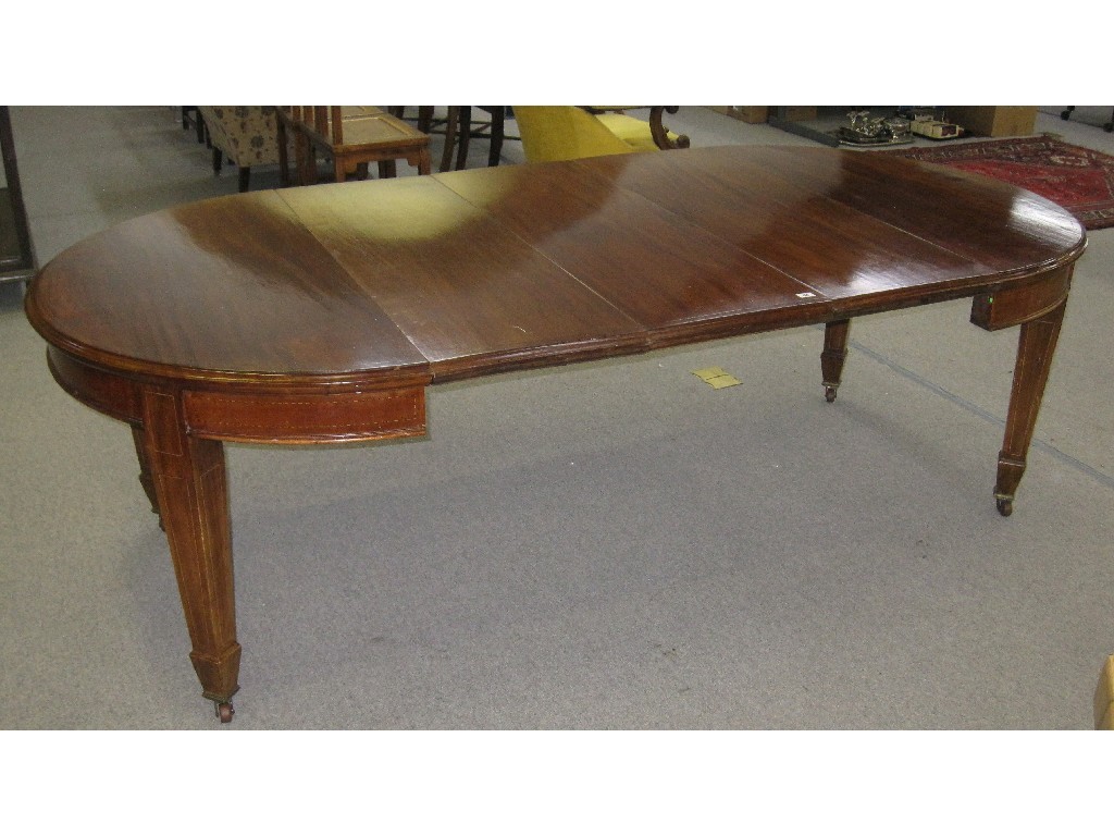 Appraisal: Edwardian mahogany and checkered string inlaid circular wind-out dining table