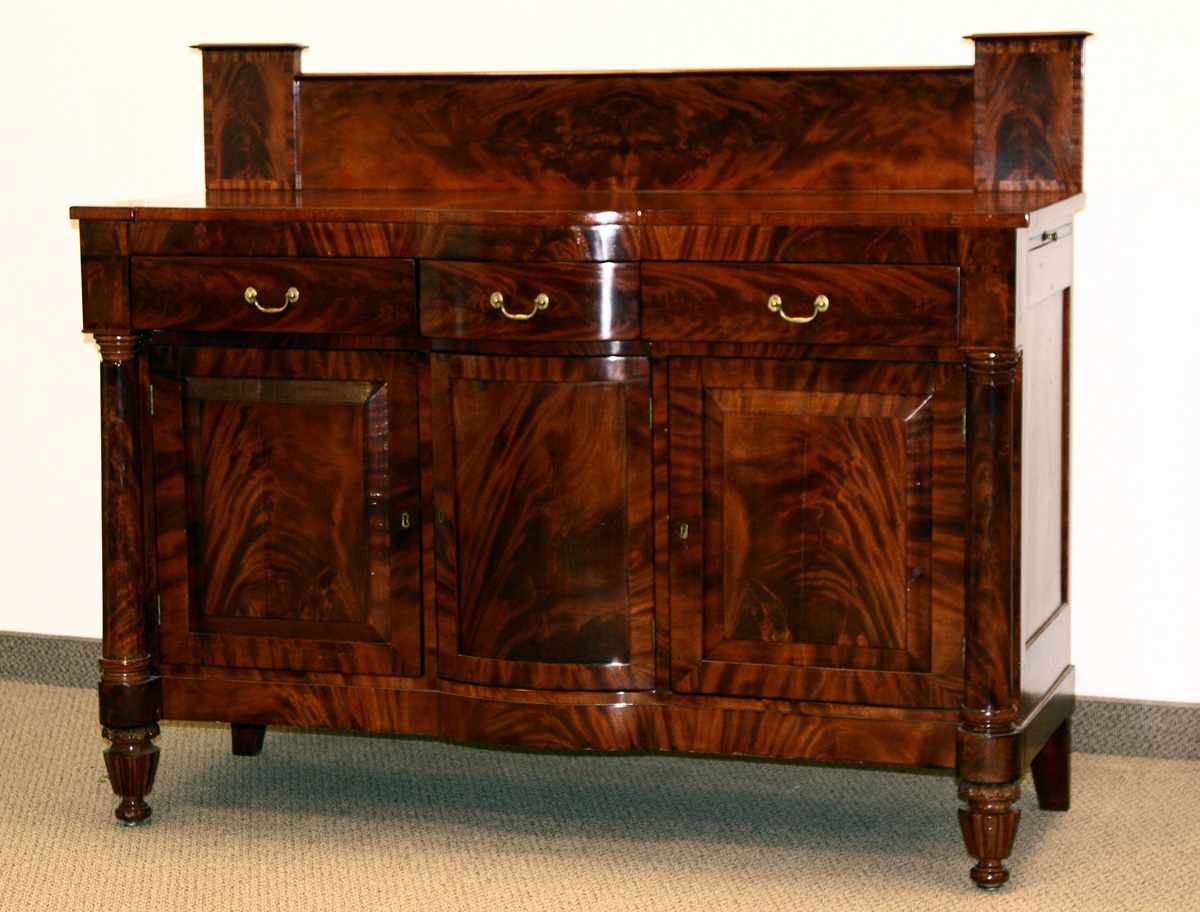 Appraisal: Early Empire Crotch Mahogany Sideboard Raised panel doors full columns