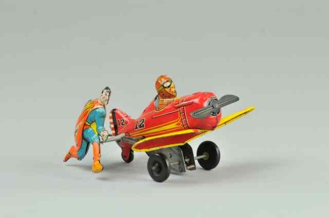 Appraisal: SUPERMAN ROLLOVER PLANE Marx Toys lithographed tin interesting toy depicting