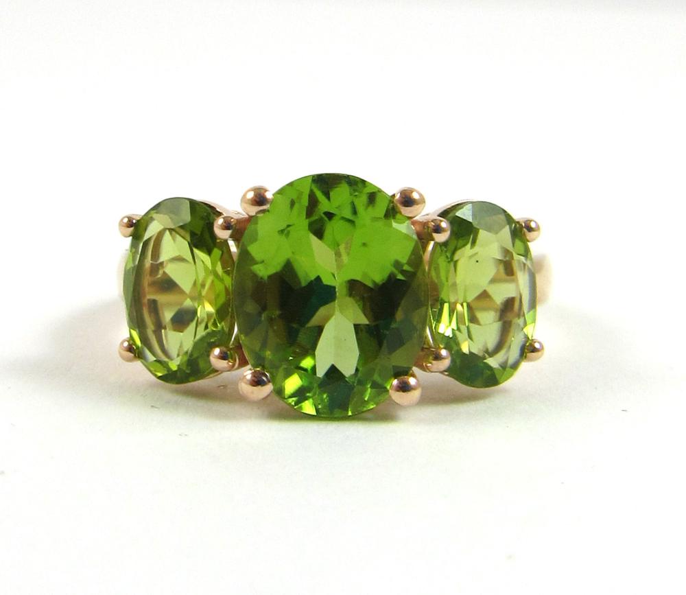 Appraisal: PERIDOT AND FOURTEEN KARAT ROSE GOLD RING The -stone ring