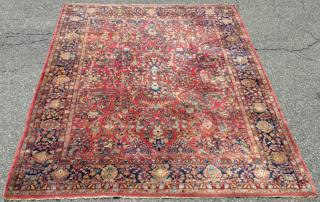 Appraisal: Room size Sarouk carpet with red field ' x '