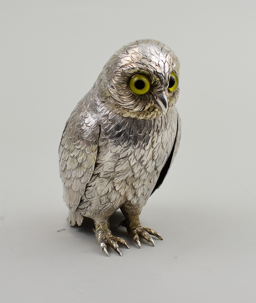 Appraisal: SILVERPLATE FIGURE OF AN OWLModern Unmarked Glass inset eyes Height