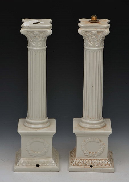 Appraisal: A PAIR OF WHITE CERAMIC TABLE LAMPS of classical corinthian