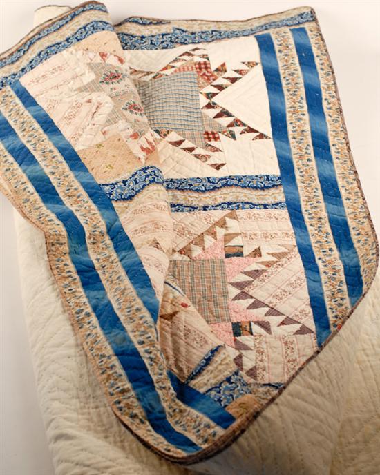 Appraisal: A Feathered Star Pieced and Hand Stitched Quilt in printed