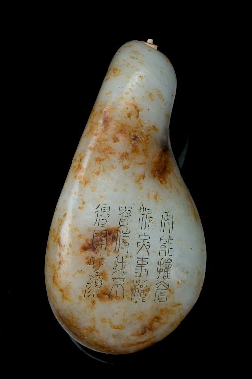 Appraisal: WHITE JADE SNUFF BOTTLE WITH INCISED CHARACTER Of gourd form