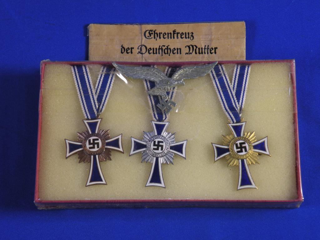 Appraisal: Three rd Reich Mothers Crosses each decorated in blue and