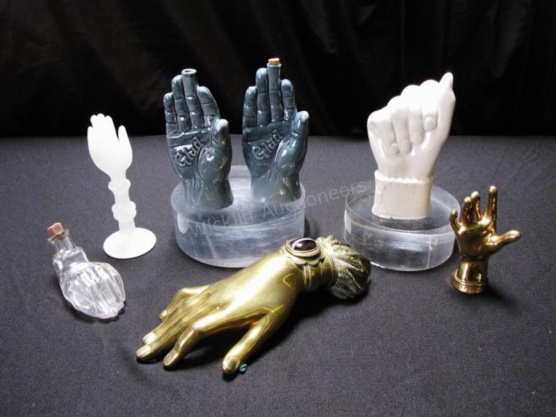 Appraisal: A group of 'hand' decor seven items made of brass