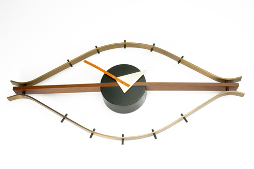 Appraisal: GEORGE NELSON HOWARD MILLER Brass and walnut Eye clock with