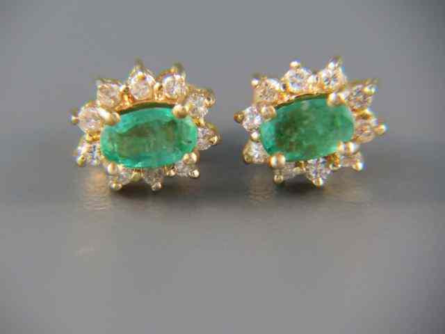 Appraisal: Emerald Diamond Earrings oval gems surrounded by diamonds carat total