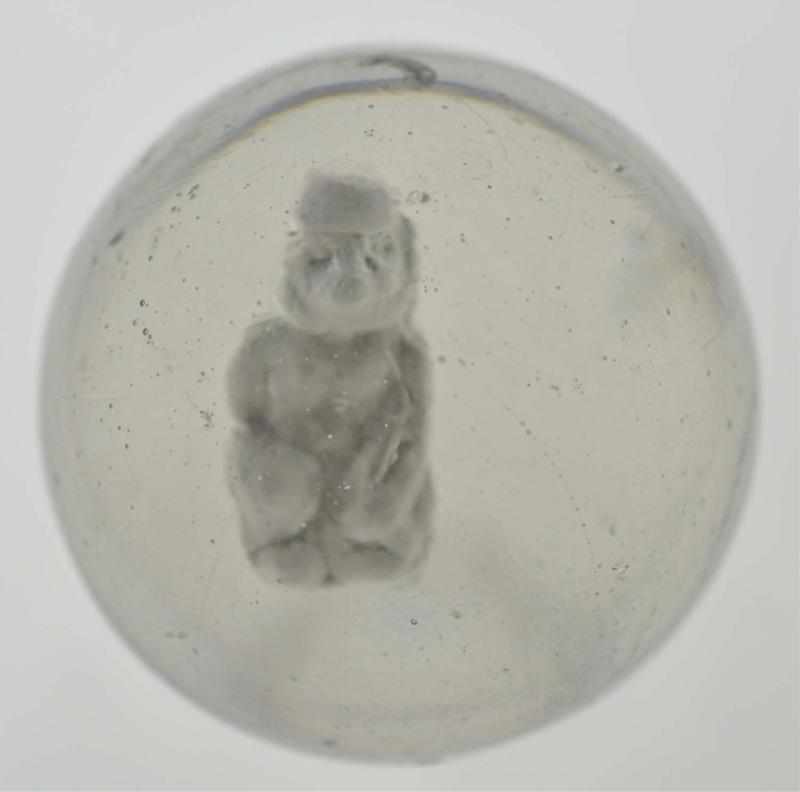 Appraisal: Seated Monkey Sulphide Marble Description Monkey wearing fez figure with