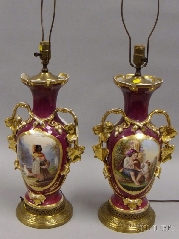 Appraisal: Pair of Paris Porcelain Hand-painted Boy and Girl with Dogs