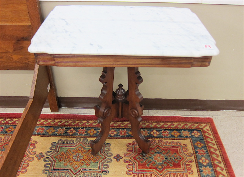 Appraisal: VICTORIAN MARBLE-TOP WALNUT LAMP TABLE Eastlake influence American c having