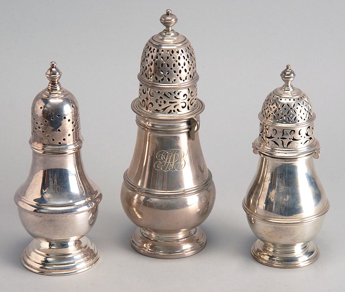 Appraisal: THREE ENGLISH SUGAR CASTERS Late th Early th CenturyTwo sterling