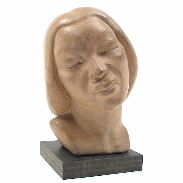 Appraisal: A glazed terracotta head of a woman height in width