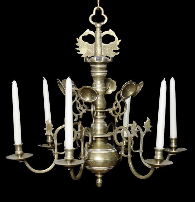 Appraisal: DUTCH BAROQUE-STYLE BRASS FIVE-LIGHT CHANDELIER The baluster-form standard with double-headed