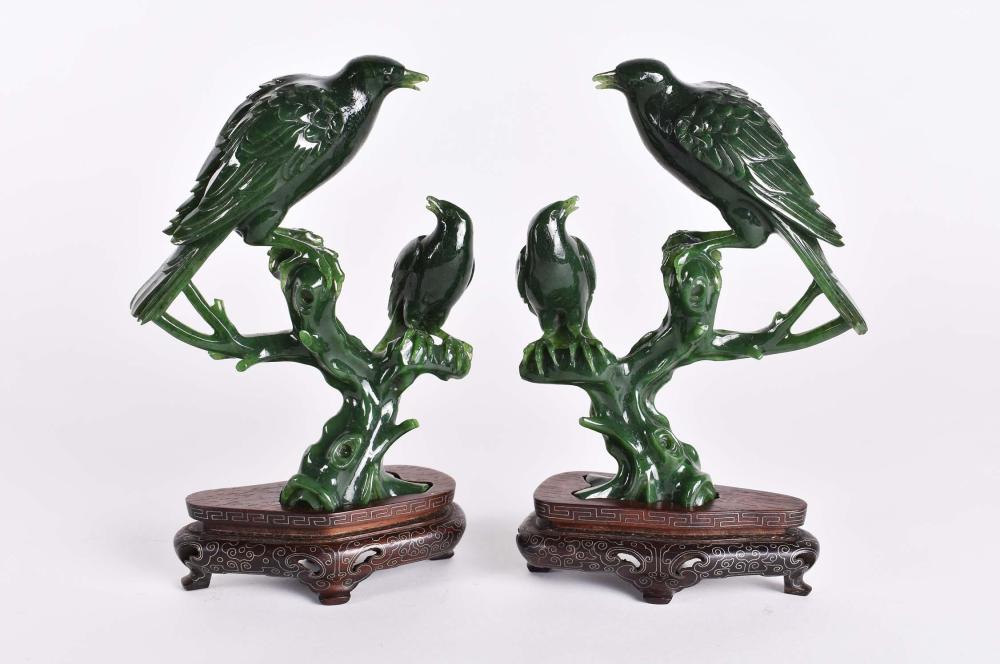 Appraisal: PAIR OF CHINESE SPINACH JADE BIRD GROUPSEach evenly toned well-carved