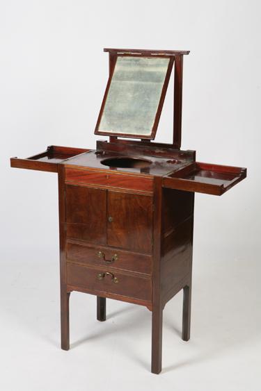 Appraisal: A GEORGE III MAHOGANY WASHSTAND with a two part rising