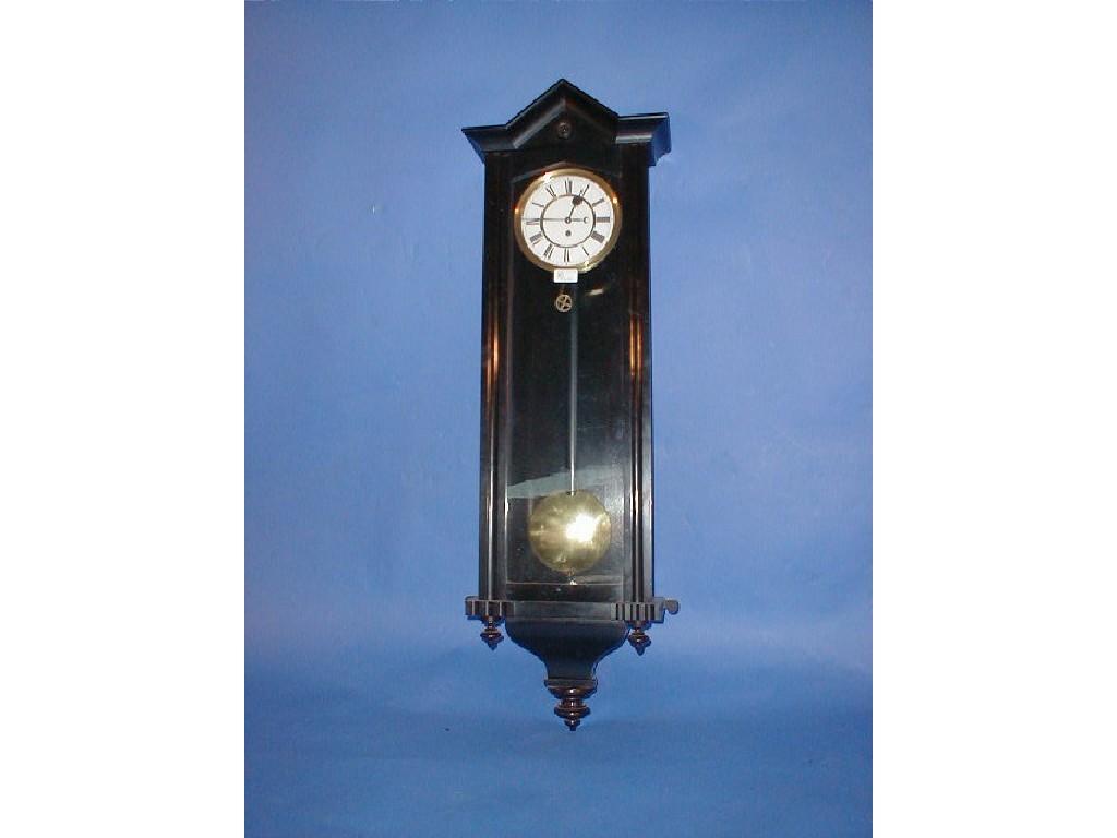 Appraisal: A mahogany cased single weight wall clock with architectural pediment