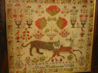 Appraisal: A WOOLWORK PICTURE by Mary Kettlewood depicting a tiger attacking